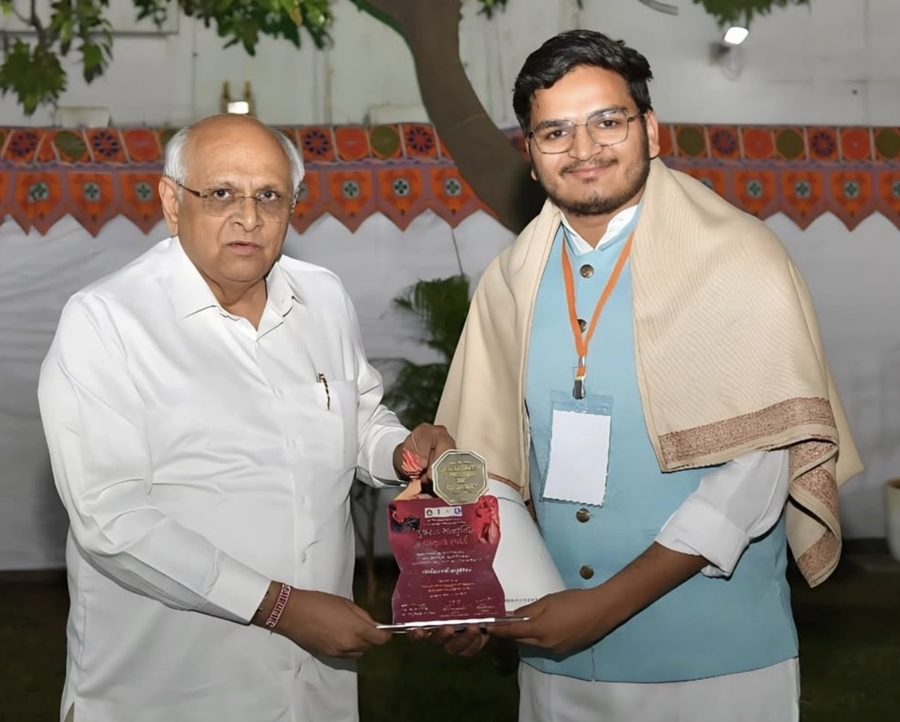 Parth Moradiya receiving award from Chief Minister of Gujarat